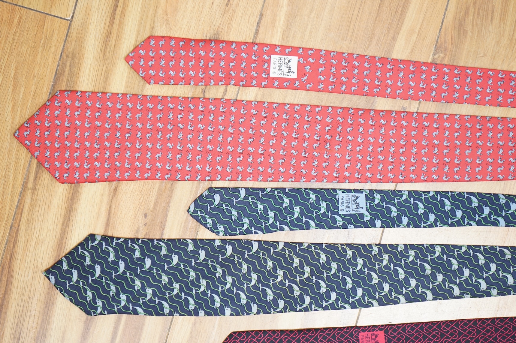 Two boxed Hermes silk scarves comprising ‘Real Escuela Andaluza del Arte Equestre’ and ‘Equateur’, with original boxes, together with four Hermes gentleman’s silk ties